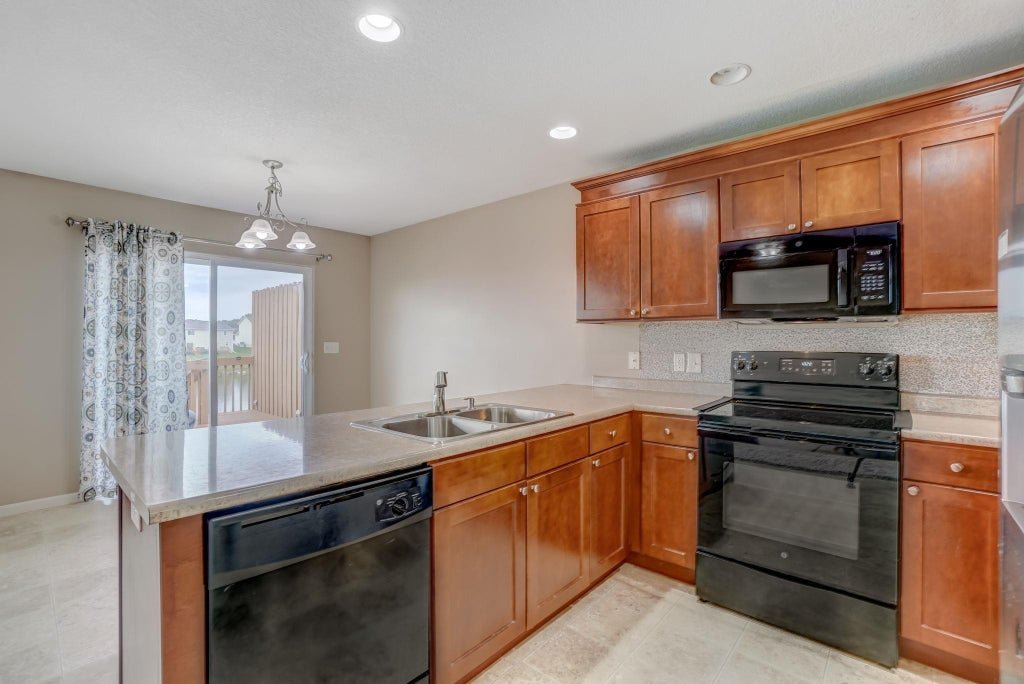 Enjoy Relaxing & Peaceful Living at this Beautiful Greenhill Village Condo